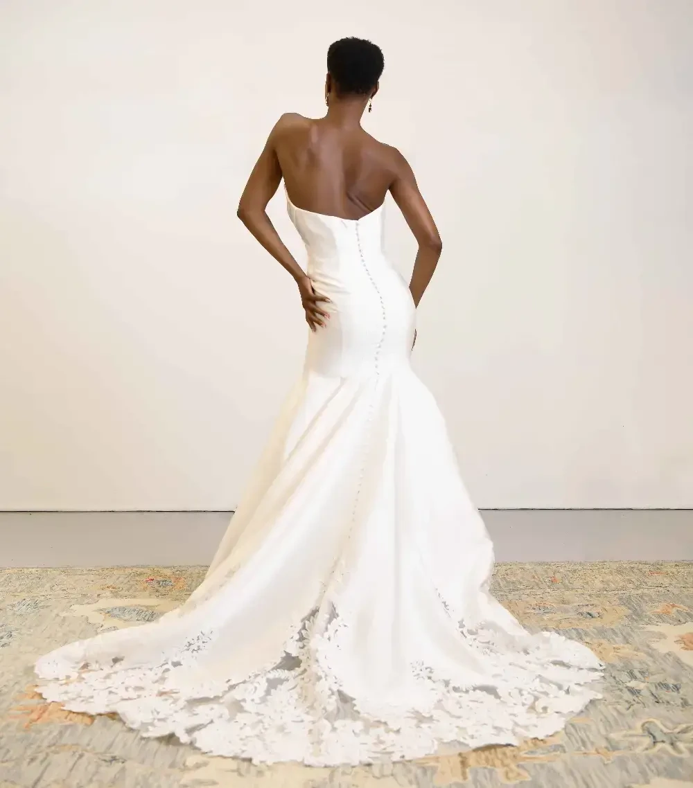 model is wearing a strapless wedding dress