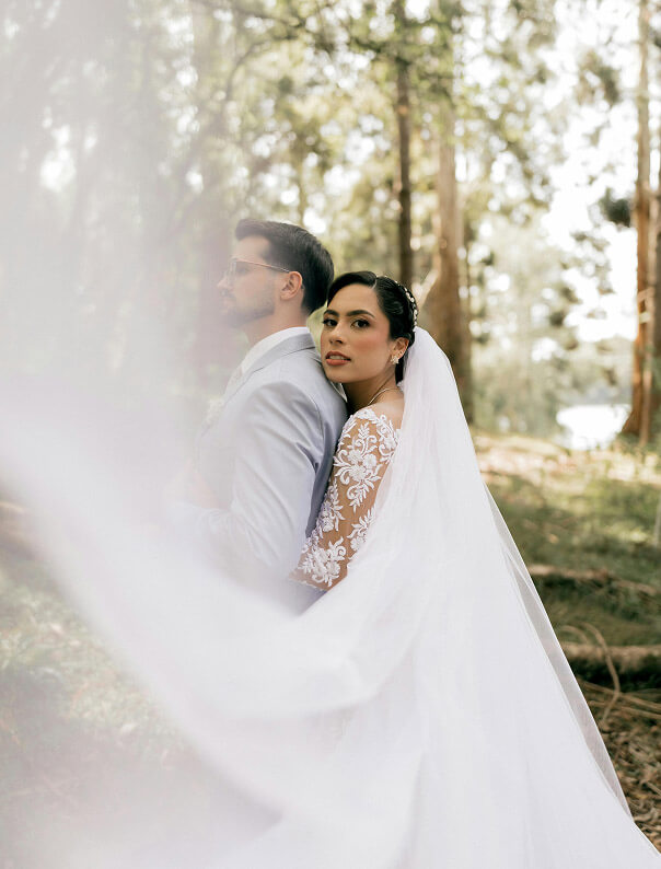 Couple wearing a white gown and a white suit